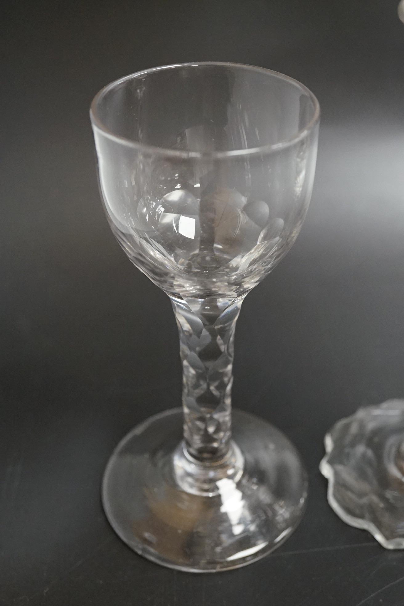 Two faceted wine glasses, c.1775, one with faceted star cut foot, tallest 15cm